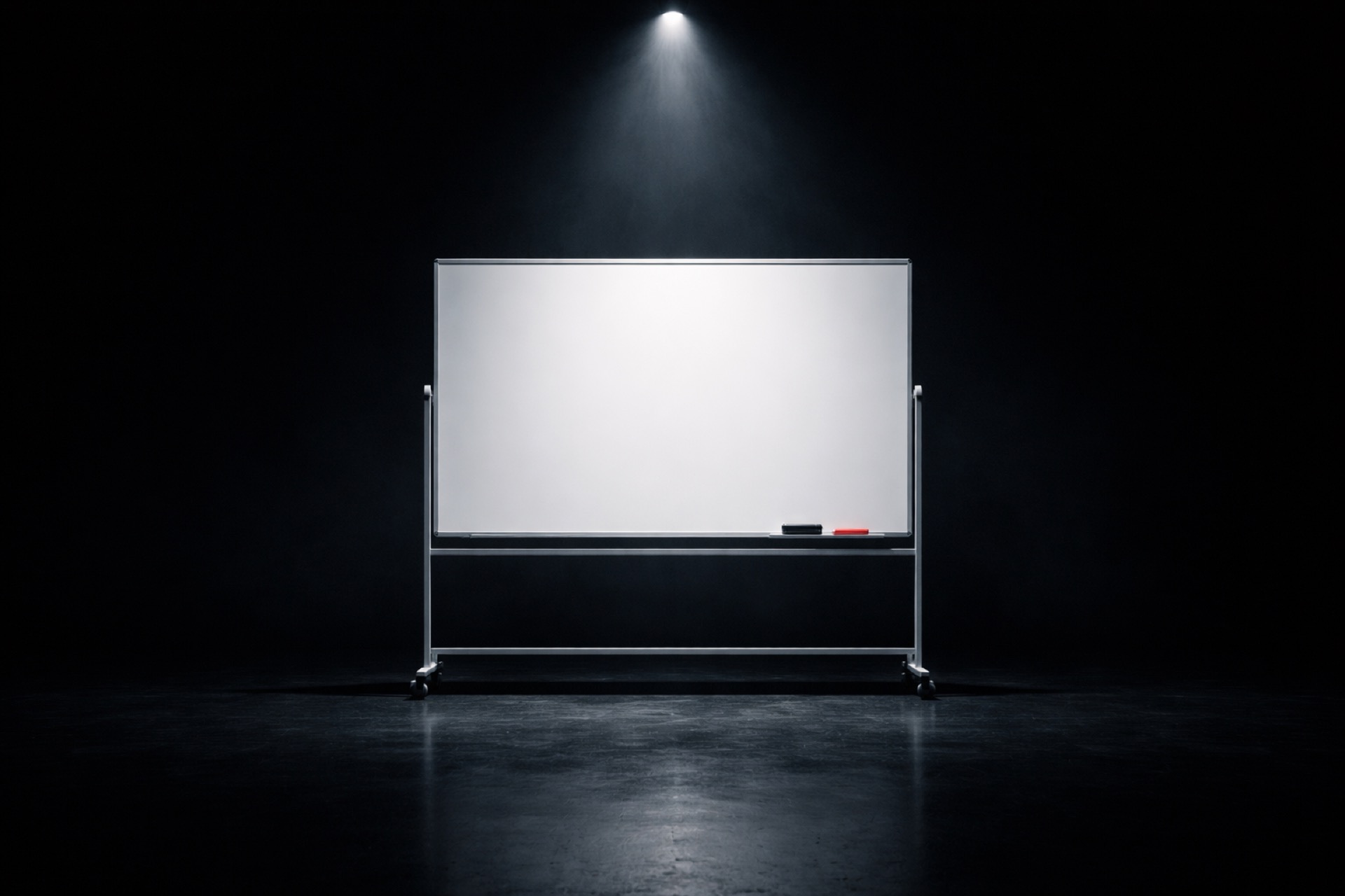 Rolling whiteboard spotlit in a dark room — mapping the installation